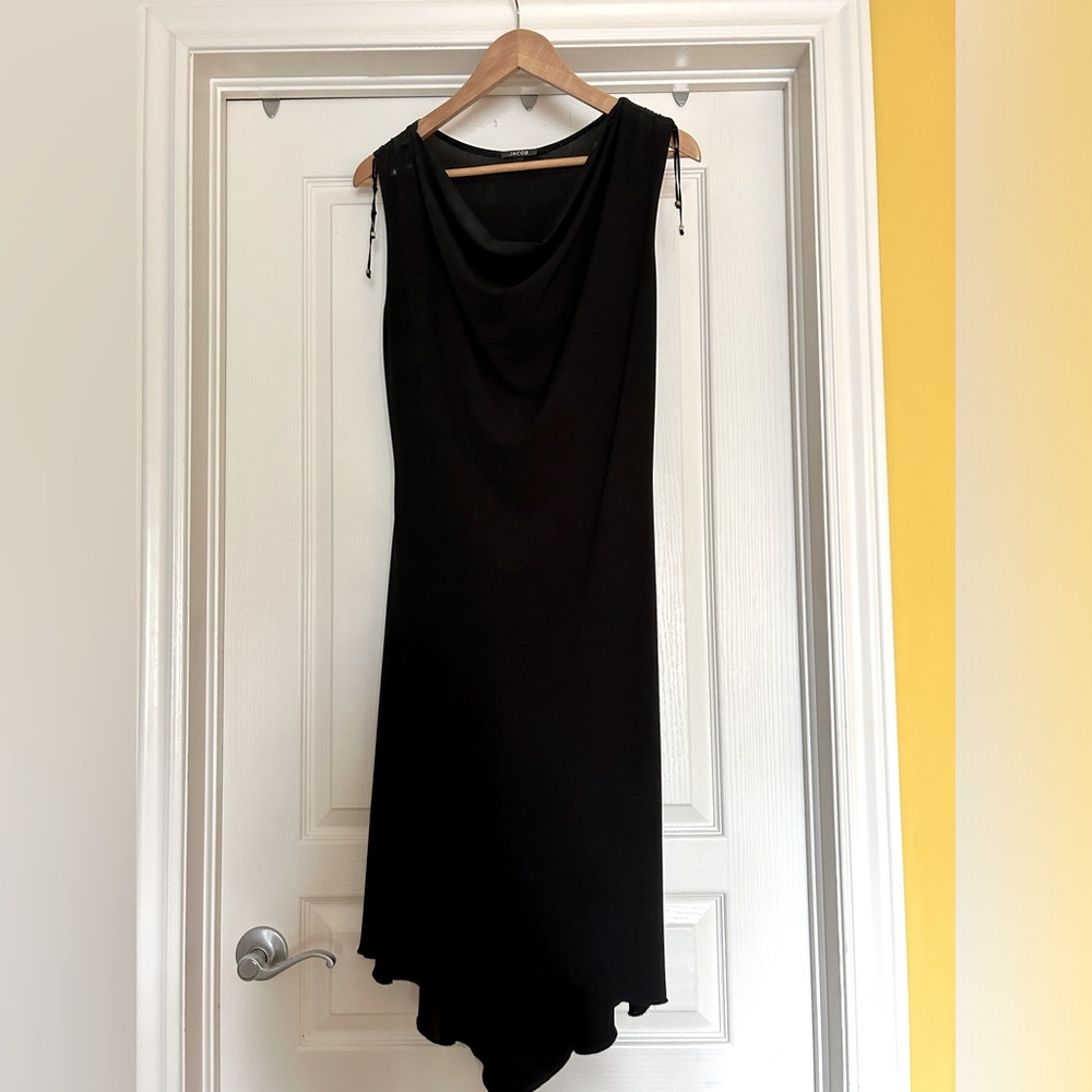 Jacob. Black knee length dress.